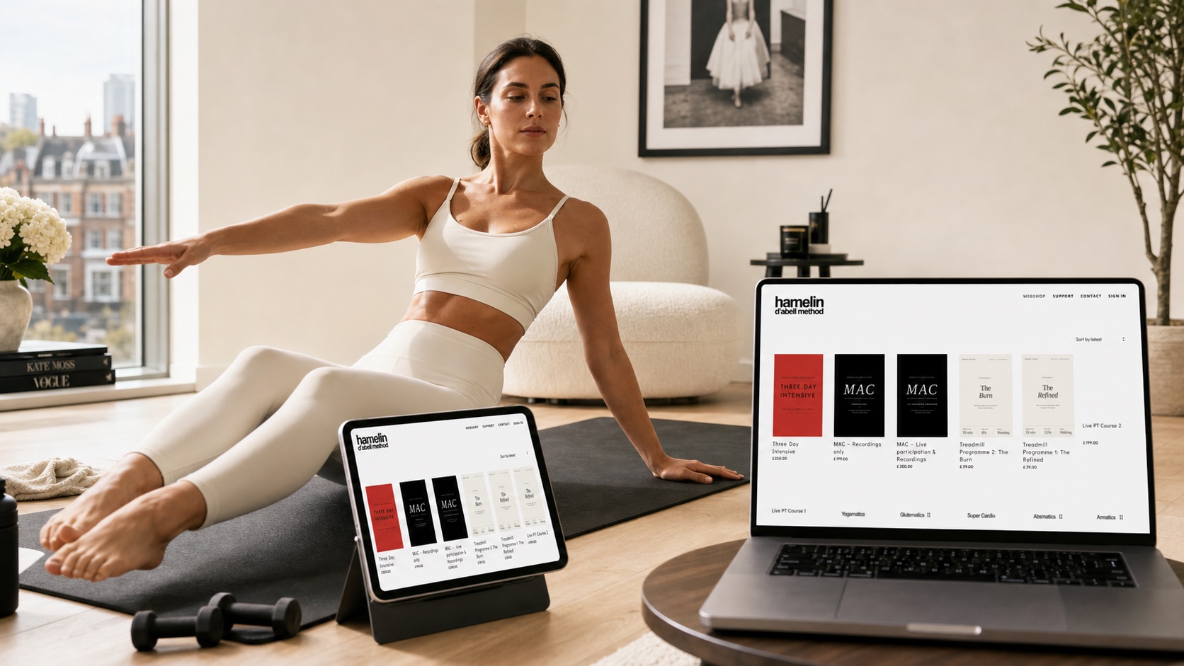 A woman training at home with the Hamelin D’abell Method platform open on a laptop and iPad.