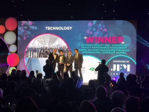 Kai Shing Management Services receiving the IWFM Impact Awards 2024 Technology Award on stage.